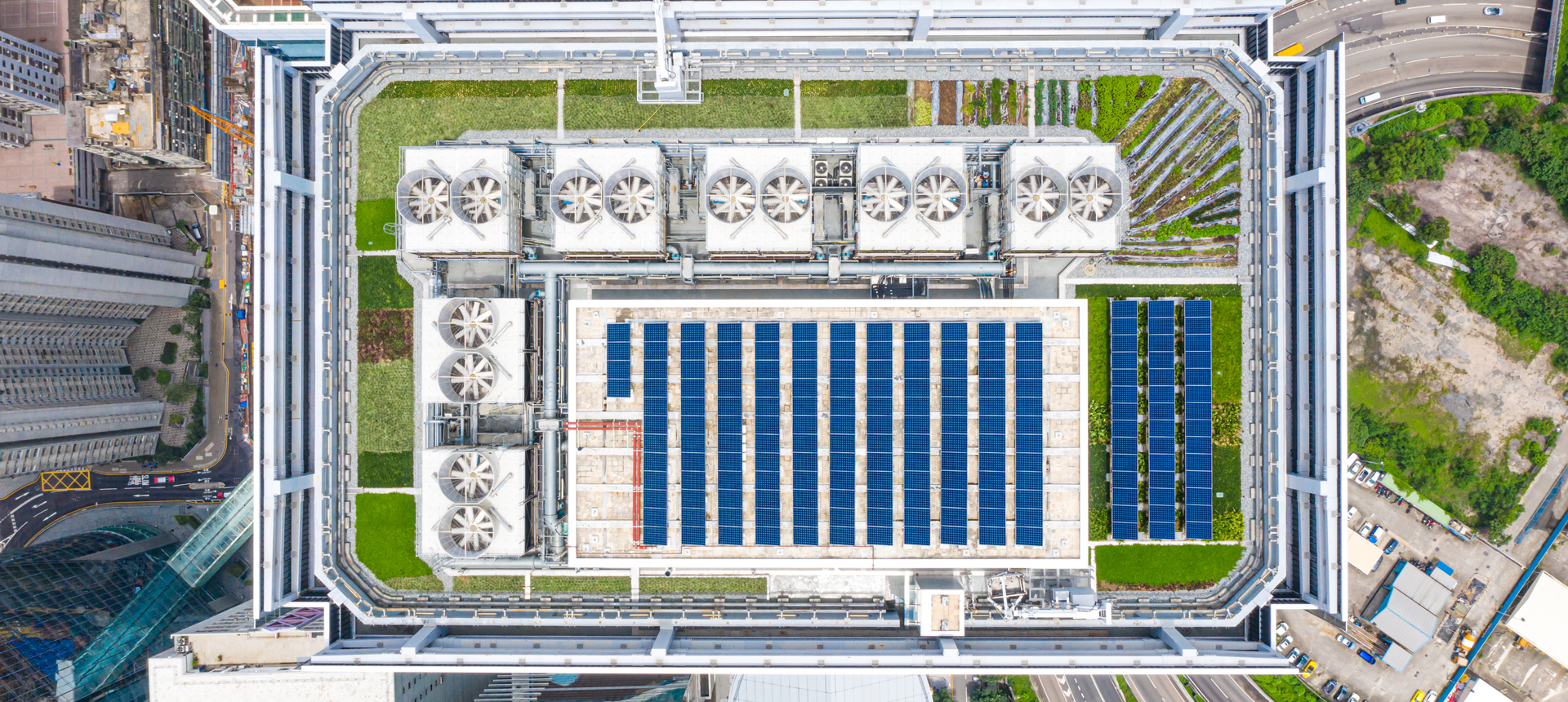 Aerial photo of building with solar panels on rooftop