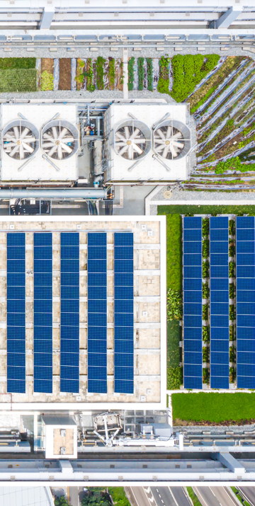 Aerial photo of building with solar panels on rooftop